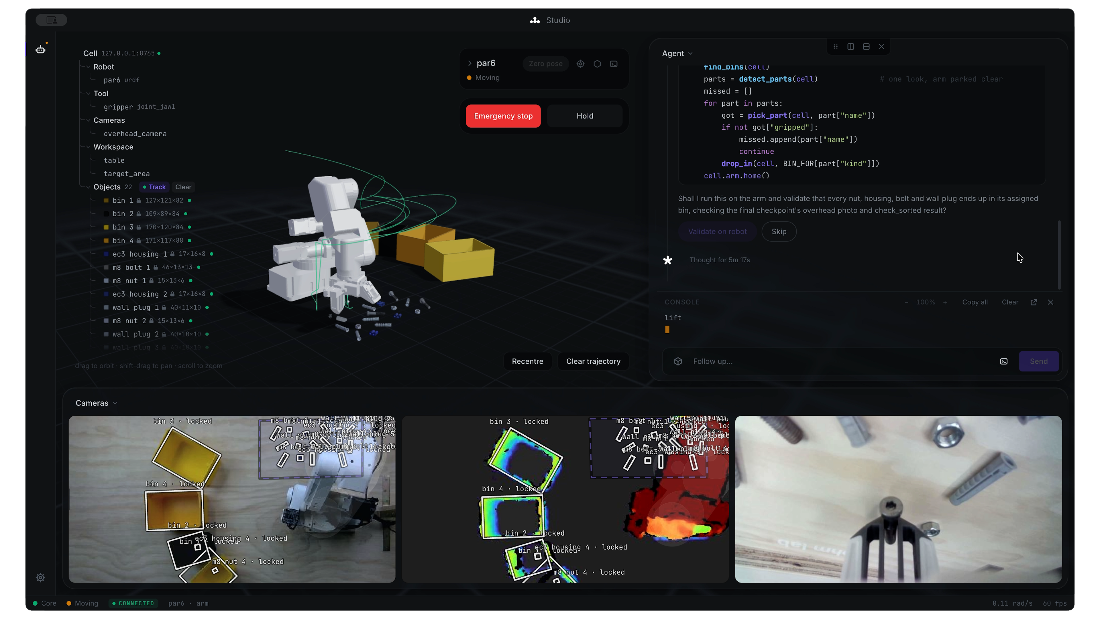 Ohm Lab Studio: a simulated robot arm, joint controls and camera feeds beside the agent panel