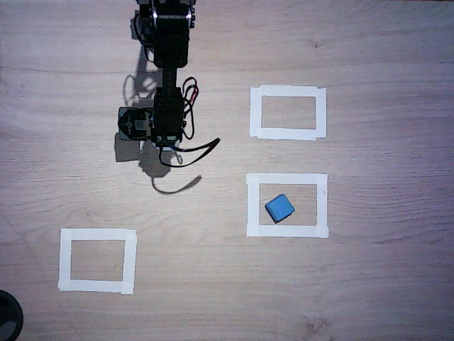 Overhead bench camera, before the attempt: block in the pickup area