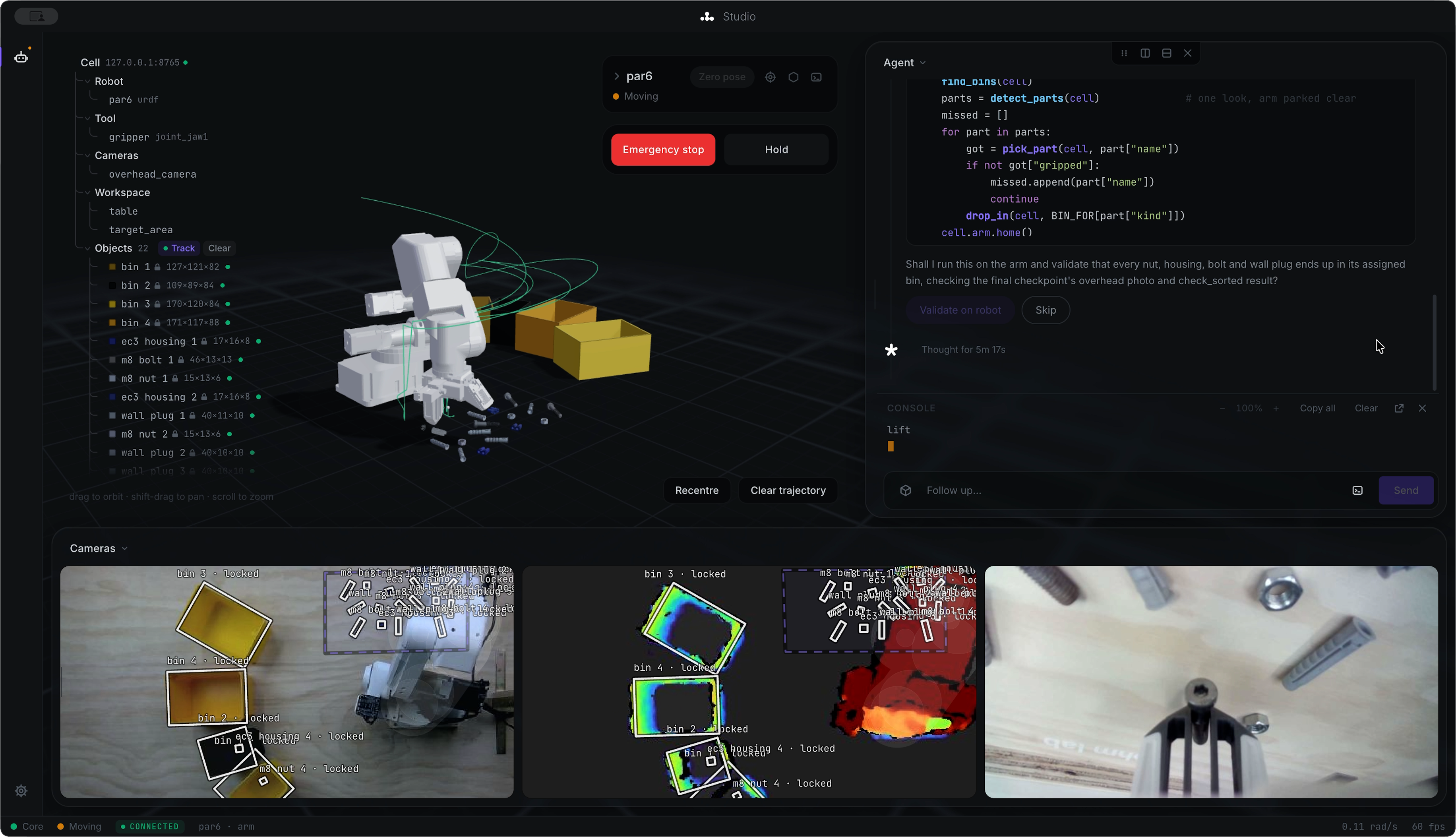 Ohm Lab Studio: the cell model, a live digital twin of the arm, camera feeds with detected parts, and the agent panel